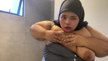Hijabi sucking her own tits