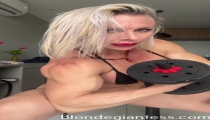 Blonde bodybuilder showing her massive muscles